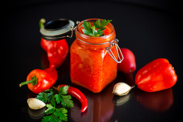 fresh natural homemade sauce made of peppers, tomatoes and other vegetables