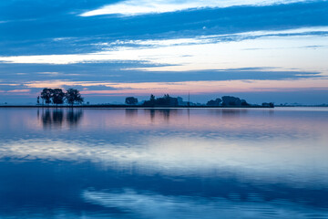Summer sunrise over lake 't Joppe in the Kagerplassen in the South-Holland village of Warmond in the Netherlands.