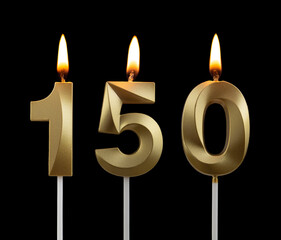 Gold birthday candles on black background, number 150