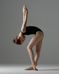 Young gymnast girl stretching and training