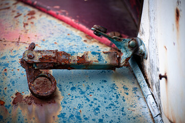 A very rusted hood latch can be seen on the Blue, White and Red body of this truck on my father's farm in Upstate NY