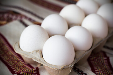 Fresh farm eggs with textile background