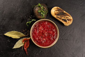 Traditional Ukrainian and Belarusian borscht. Beetroot, potato and meat soup with bay leaf, pepper and grilled white bread.