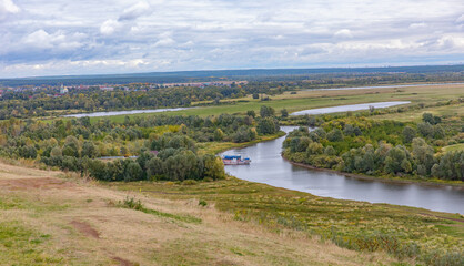 View  in early autumn from the high Bank at the confluence of the Toima river and Kama river ....