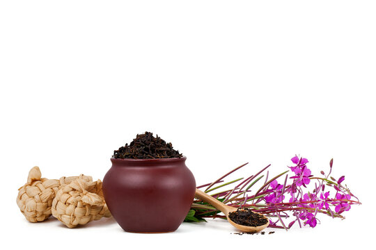 Clay pot with dry tea, bast shoes and blooming Chamerion angustifolium (common names: fireweed, great willowherb, rosebay willowherb) isolated on a white background. Russian traditional herbal tea.