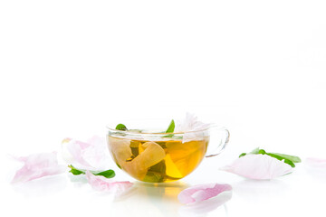summer flower tea from rose petals in a glass cup