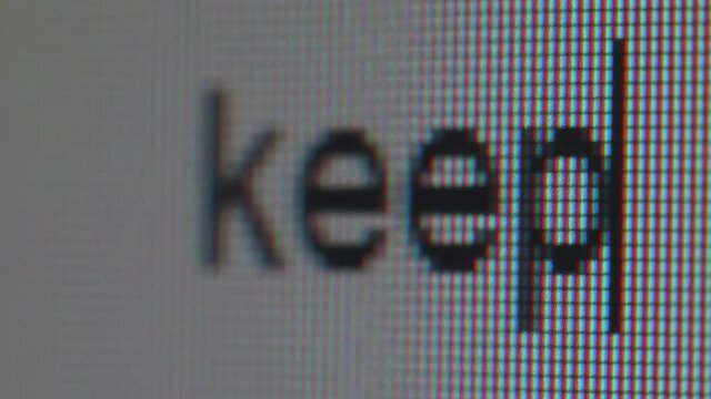Typing phrase with big letters. Macro view.