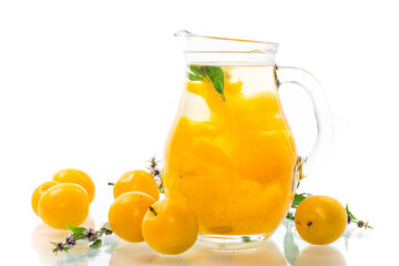 sweet cooked compote in a glass decanter of ripe yellow cherry plum