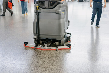 Fototapeta na wymiar cleaning floor with machine