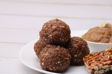 Navratri Upwas sweets food platter dry fruit laddu, groundnut chikki or toffee and sheera.