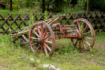 Fototapeta premium Old cart on the lawn close-up