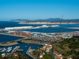 Fototapeta na wymiar port of bilbao with ships and containers. you can see some industry and the sea as well as boats