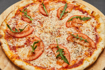 Delicious Italian Pizza Margarita on dark background