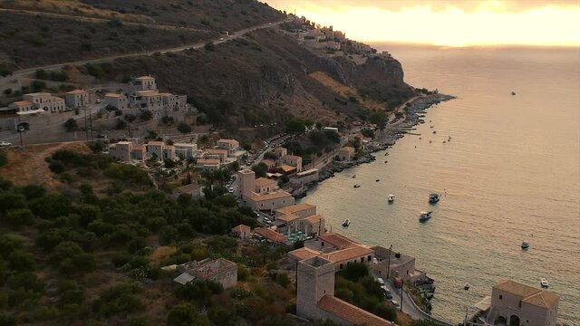 Scenic aerial view from the picturesque seaside village Limeni at sunset. Traditional houses and colorful stoned buildings and luxurious hotels in Limeni, Mani area, Laconia, Greece, Europe