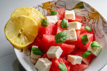 Garnish of watermelon, cheese, mint and lemon