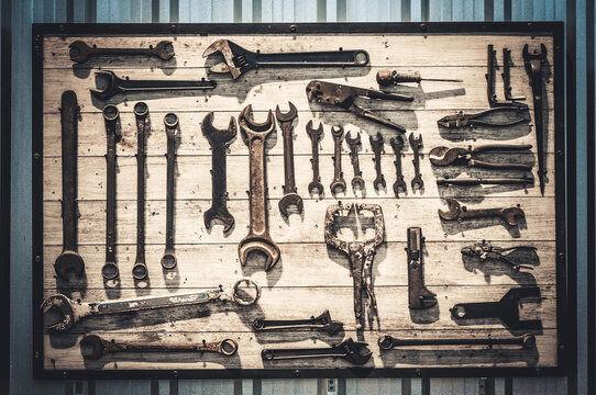 Various tool sets for car and motorcycle maintenance On a wooden panel background Self repair concept.