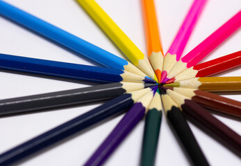 colored pencils on a white background