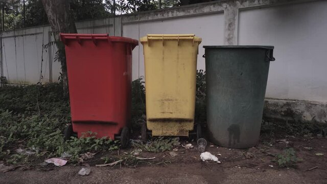 Red, green, yellow trash in the community