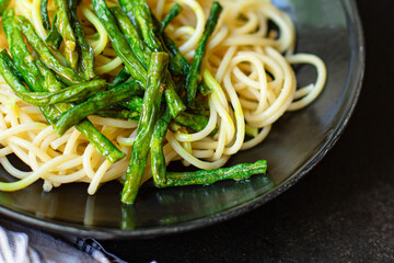 spaghetti pasta green bean asparagus sauce second course vegetarian serving size top view copy space for text food background rustic