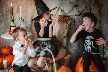 Kids eat Halloween sweets costume party