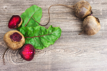 Top view at fresh organic beets with leaves on wooden rustic background. Close up view. - 378602278