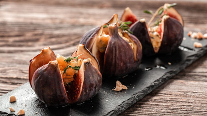 Figs appetizer with cheese, thyme and honey. Food recipe background. space for text