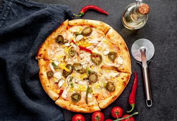 Mexican pizza with ingredients on stone background