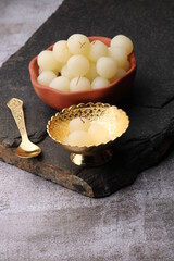 Indian Sweet Rasgulla Also Know as Rosogolla, Roshogolla, Rasagola, Ras Gulla, Anguri Rasgulla or Angoori Rasgulla is a Syrupy Dessert Popular in India. It is Madeup with milk.