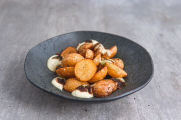 fried potatoes with parma and cheese