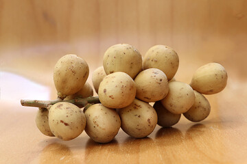 Closeup Longkong on wooden table, tropical fruit in thailand