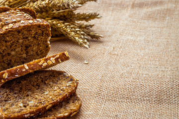 Rye bread. Bakery with crusty loaves and crumbs. Fresh loaf of rustic traditional bread with wheat...