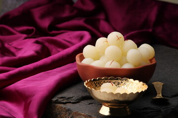 Indian Sweet Rasgulla Also Know as Rosogolla, Roshogolla, Rasagola, Ras Gulla, Anguri Rasgulla or Angoori Rasgulla is a Syrupy Dessert Popular in India. It is Madeup with milk.