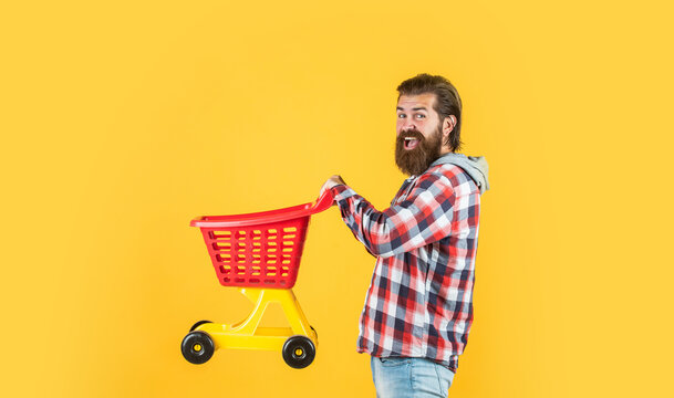 Man Go Shopping. Funny Man With Small Shopping Cart. Weekend On Buying Products. Rejoices Successful Purchases. Brutal Mature Hipster Go Shopping. Its Time To Fill The Cart