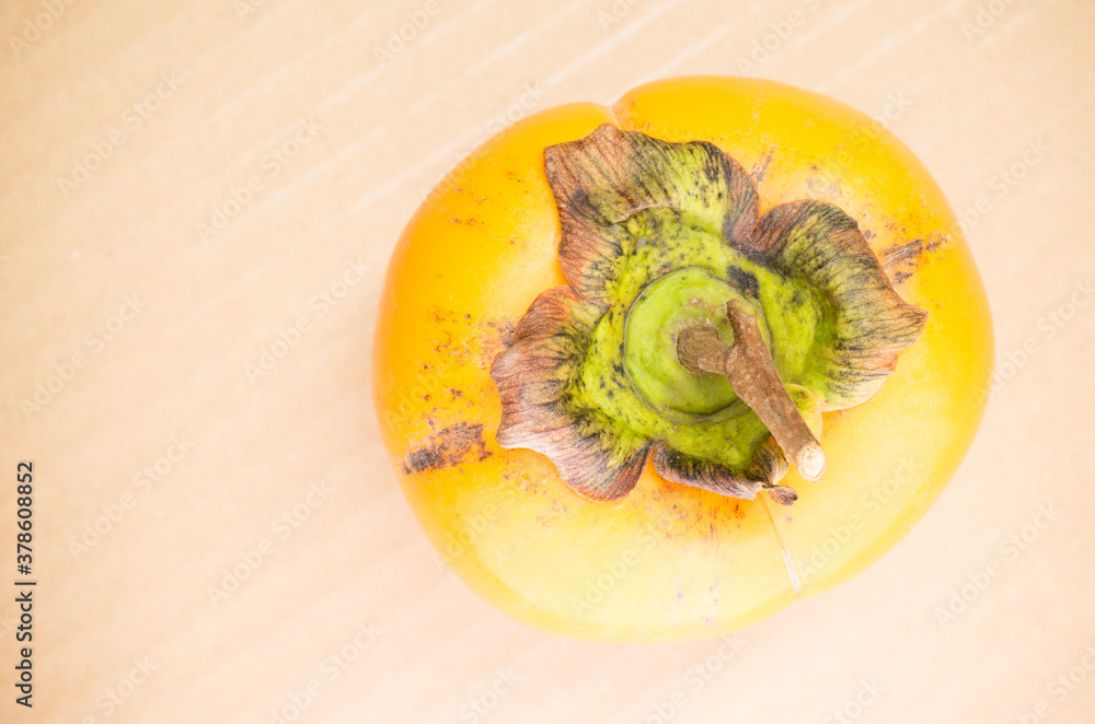 Wall mural natural organic persimmon fruit top view