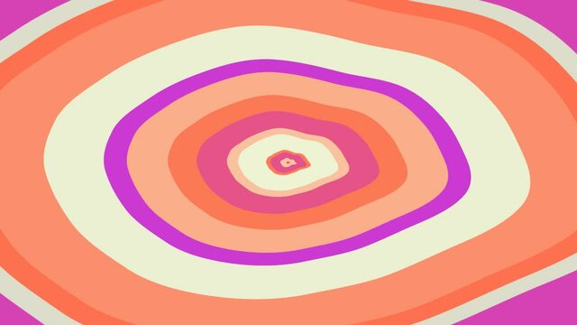 Yellow orange and purple stain turning round the middle point in slow hypnotic rhytm.  Bright colorful abstraction changes turning.