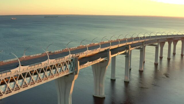 High-speed toll road, highway bypassing the city center St. Petersburg, the central section of the western high-speed section. A beautiful view of the sunset over the Gulf of Finland.