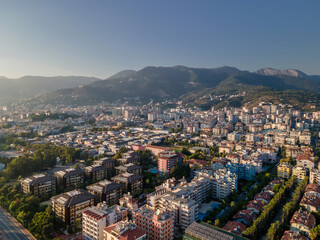 Obraz premium Beautiful small town near high mountains in the sun