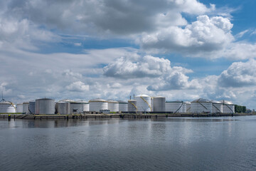 Tanker and oil storage tanks in Rotterdam, Netherlands. The port is the largest in Europe and facilitate the needs of a hinterland