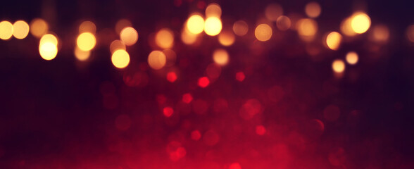 background of abstract red, gold and black glitter lights. defocused