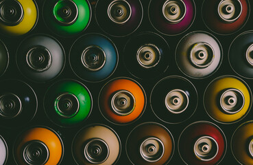 texture of multi-colored spray cans with paint for graffiti, for background and screen saver