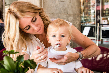 Mother feeding her young child