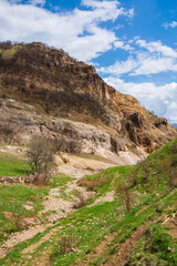 Rocky landscape under the blue cloudy sky