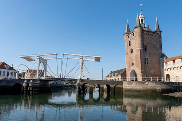 Fototapeta na wymiar Old city gate built with red bricks, Zuidhavenpoort, Zierikzee, Netherlands