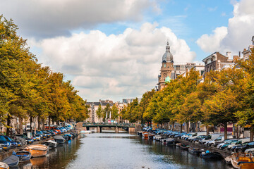 canal and boats in Amsterdam on an sunny autumn day