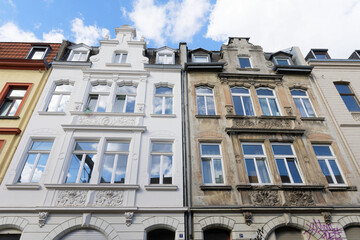 renovated and not renovated old building twins in cologne