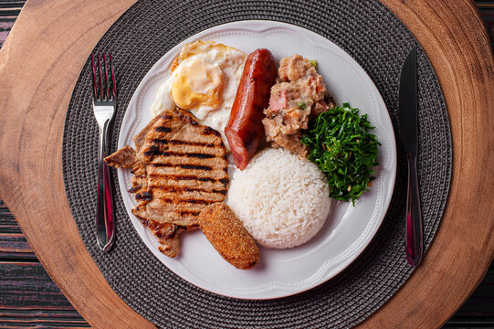 .Typical dish of Brazilian cuisine called virado a paulista. Top view