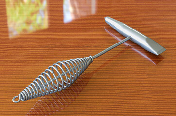 Welding Chipping Hammer on the wooden table. 3D rendering