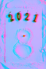 A snowman made of flour with carrots and matches. New Year's Concept Postcard 2021.