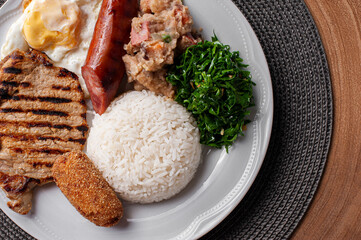 .Typical dish of Brazilian cuisine called virado a paulista. Top view