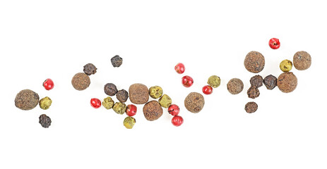 Mixed of peppers hot, red, black, white and green pepper isolated on white background, top view.
